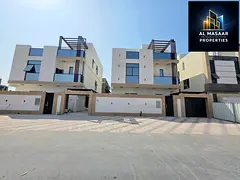 Luxury villa for sale in Al Helio 2, Ajman, including electricity, water, and central air conditioni
