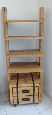 Wooden open shelving unit with rolling drawer trunk