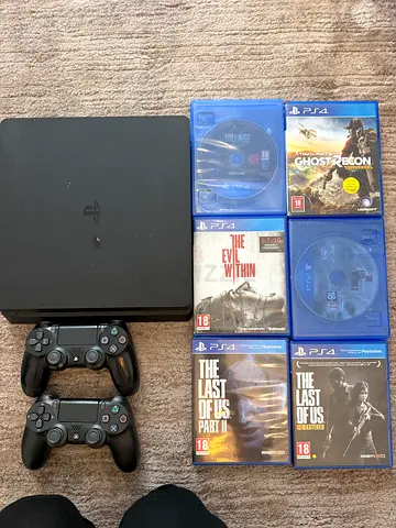 PS4 with 2 controllers + 6 games (Excellent condition)