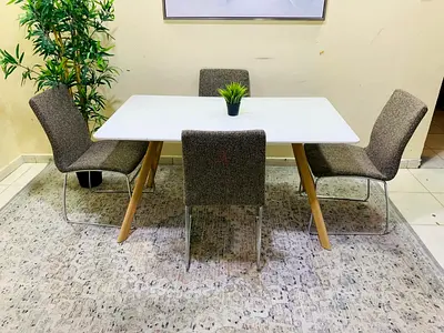 My modern white dining table with 4 grey upholstered chairs