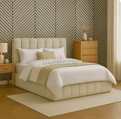 Beige upholstered bed with padded headboard