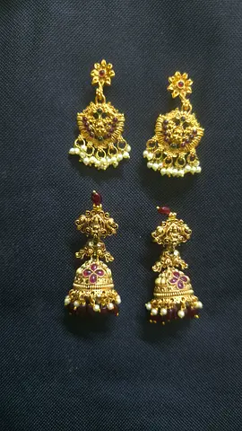 Two pairs of traditional gold-tone jhumka earrings