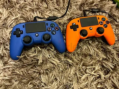 Two wired PS4-compatible controllers — blue  orange (you can buy them individually if you want)