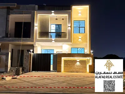 Luxury villa for sale in Al Yasmeen with 4 master bedrooms, 6 bathrooms, spacious rooftop, high-end finishing, prime location, price includes registra