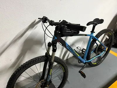 Blue hardtail mountain bike - lightly used price negotiable