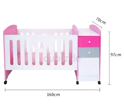 Brand new pink and white baby crib with side storage (on wheels)