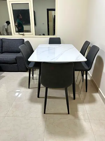 Elegant 6-seater dining set with a modern marble-finish tabletop, perfect for stylish homes.