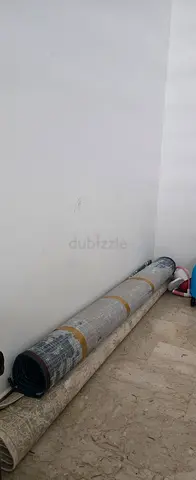 Two rolled Persian-style rugs Im selling (Middle Eastern design)