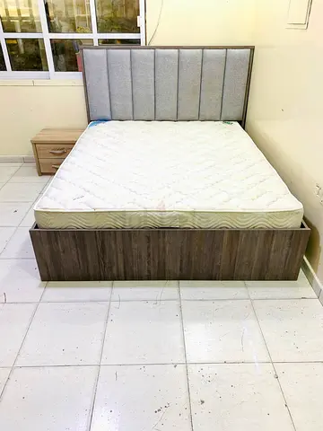 My wooden bed frame with mattress and bedside table