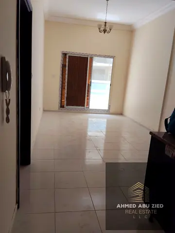 One bedroom with living room for rent in Emirates City Ajman, master room, maid room, balcony, central AC, American kitchen, Sheikh Mohammed Bin Zayed
