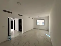 Room and hall _ Al Jurf 3 Ajman _ ground floor _ central air conditioning _ new building _ families