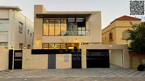 Villa for sale in Al Rawda 2, 5 master bedrooms, with a majlis, living room, modern kitchen, and mai