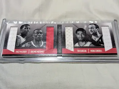 Memorabilia Tmac/Mutombo and Tim/Manu - Panini preferred. GAME USED.