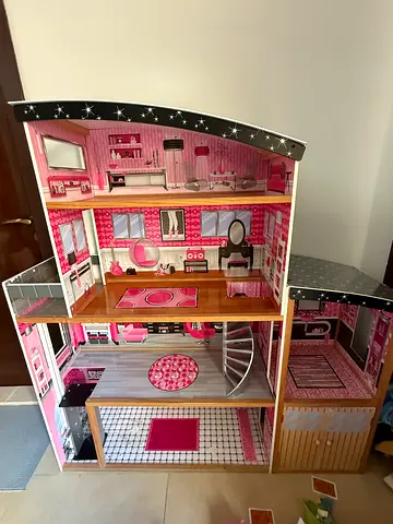 My daughters large wooden 3-storey pink dollhouse with furniture comes with furnitue  and some toys
