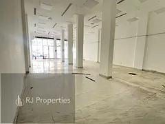 VERY PRIME LOCATION LUXURY HUGE SIZE SHOP WITH WASHROOM FRONT MAIN ROAD READY TO MOVE JUST 215K