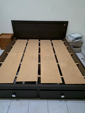 Dark wooden bed frame with headboard (slatted base) and storage