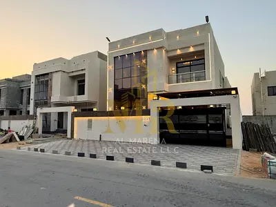 Villa for sale in Ajman | Al Helio 2 area | 6 bedrooms, majlis, living room, maid's room, and roof terrace | Freehold for all nationalities | Price ne