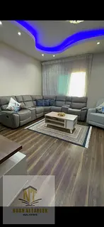 Apartment for sale in Al Qasba, two rooms, a hall, two bathrooms, a balcony with side sea views, a
