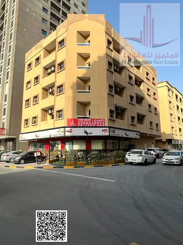 For annual rent in Ajman: two bedrooms, a living room, two bathrooms, and a balcony in Hashim Build