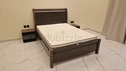 Wooden single bed frame with mattress and 2 bedside tables