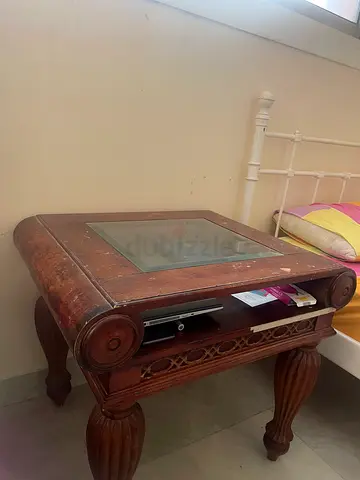 Carved solid wood coffee table with glass inset. big wood table with a small wood table living room