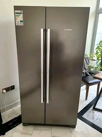 Bosch side by side refrigerator same like new condition working perfectly for sale