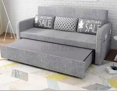 Grey  fabric day bed with pull-out trundle