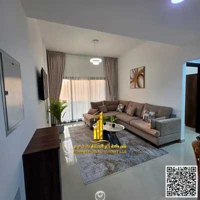 Luxury one-bedroom apartment with a living room and balcony offering an open view. Ajman, Al Nuaimiya. Fully furnished for monthly rent.
