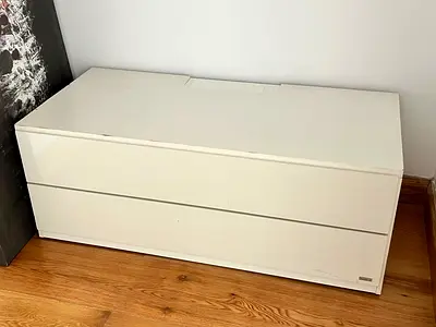 White two-drawer low TV/storage cabinet