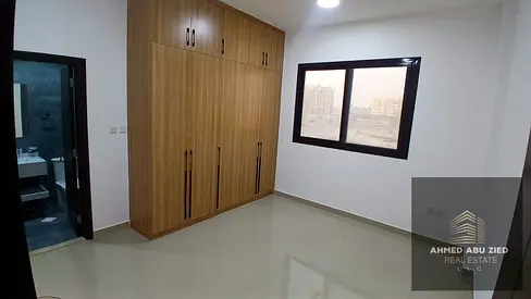 One bedroom and living room in Al Muwaihat 3, near Mohammed Bin Zayed exit. The bedroom is a master suite with two bathrooms. Second occupancy. Price