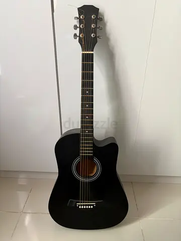 My black acoustic guitar (good condition) new strings but 1 missing only few scratches but amazing