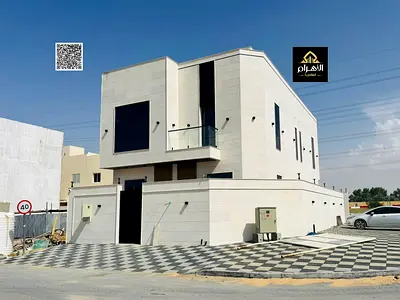 Corner villa for sale in Al Helio area, Ajman. Modern design, ground floor, first floor and roof (5 rooms, price includes registration fees).