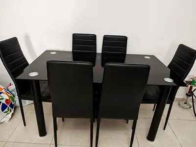 My 6-seater black glass dining table with faux leather chairs