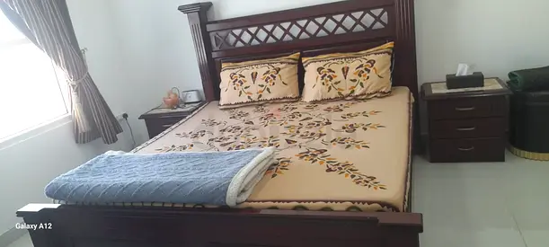 Stylish Wooden bed with side drawers
