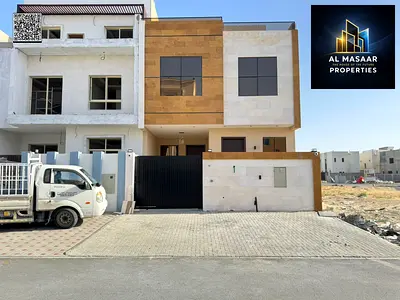 For sale in Ajman, Al Helio 2 area: a villa consisting of 4 master bedrooms, a majlis (formal sitting room), a living room, a maid's room, and a rooft