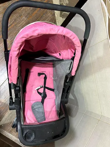 Pink lightweight baby stroller (used)