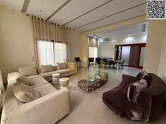 Villa for sale in Al-Talla - 5 master bedrooms with a majlis, living room, and fully equipped kitche