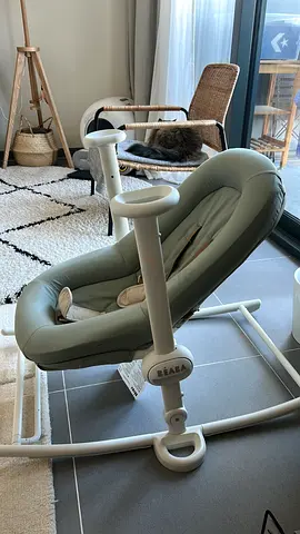 Gently used light green baby bouncer seat
