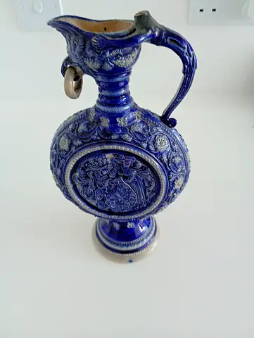 Vintage blue embossed ceramic ewer — decorative pitcher