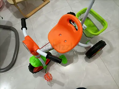 Orange  green tricycle - good condition