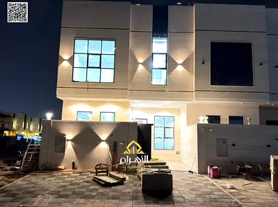 Luxury villa for sale in Al Bahia area, featuring two floors and a rooftop terrace. Modern design, spacious living areas, reception halls, and compreh