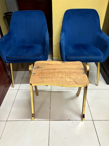 Fancy blue arm chairs with table