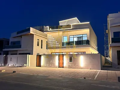 Villa for sale in Ajman | Al Helio 2 area | 5 bedrooms, majlis, 2 living rooms, maid's room, and roof terrace | Freehold | Price includes registration
