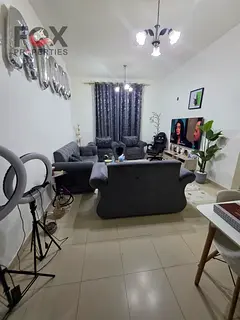 2BR in City Tower, 1154 sqft with parking, AED 195K down, AED 4,600 monthly, total AED 495K.