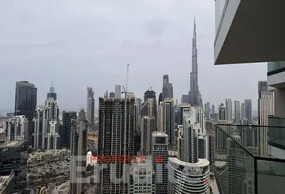 High-Floor 1BR | Peninsula Three | Canal & Burj View | Balcony