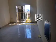 Luxury 1-bedroom apartment with living area, bathroom, and balcony for annual rent in a prime locati