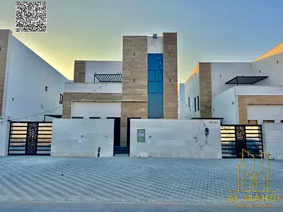 Luxury villa in Al Helio 2, Ajman, ready for immediate occupancy with high-end finishes and spacious living areas. Freehold ownership for all national