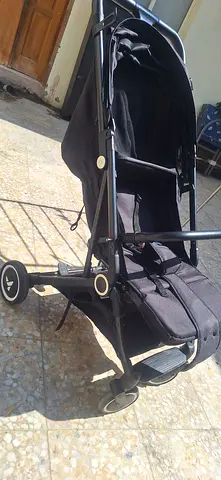 My black lightweight folding stroller — good condition