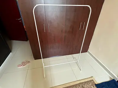White freestanding metal clothes rack – lightweight garment rail