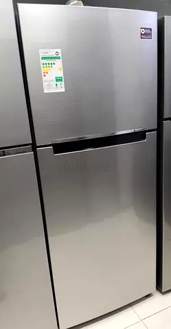 Stainless steel top‑freezer refrigerator - good condition